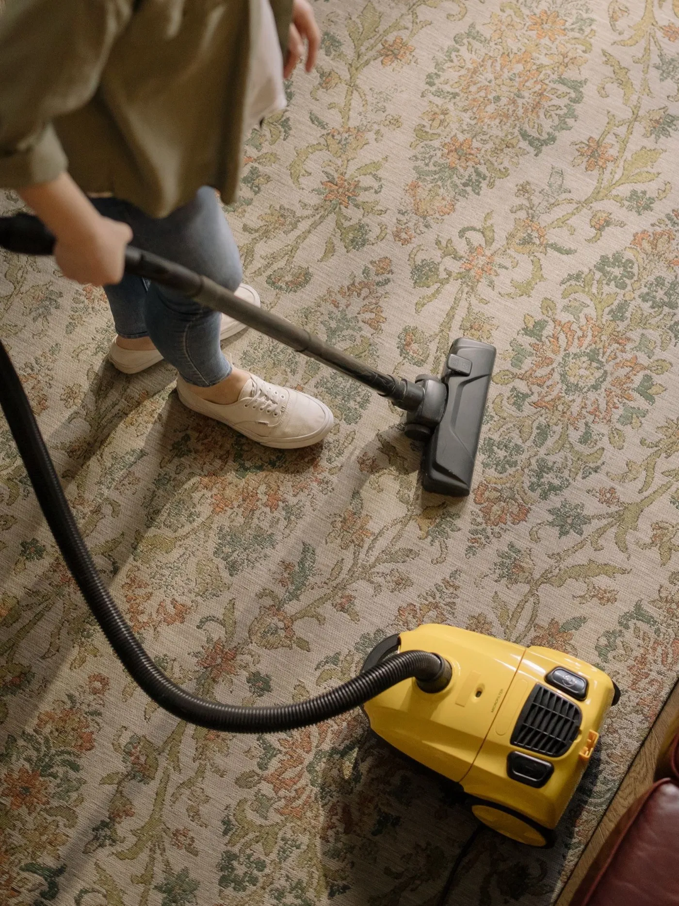 Vacuuming carpet at home
