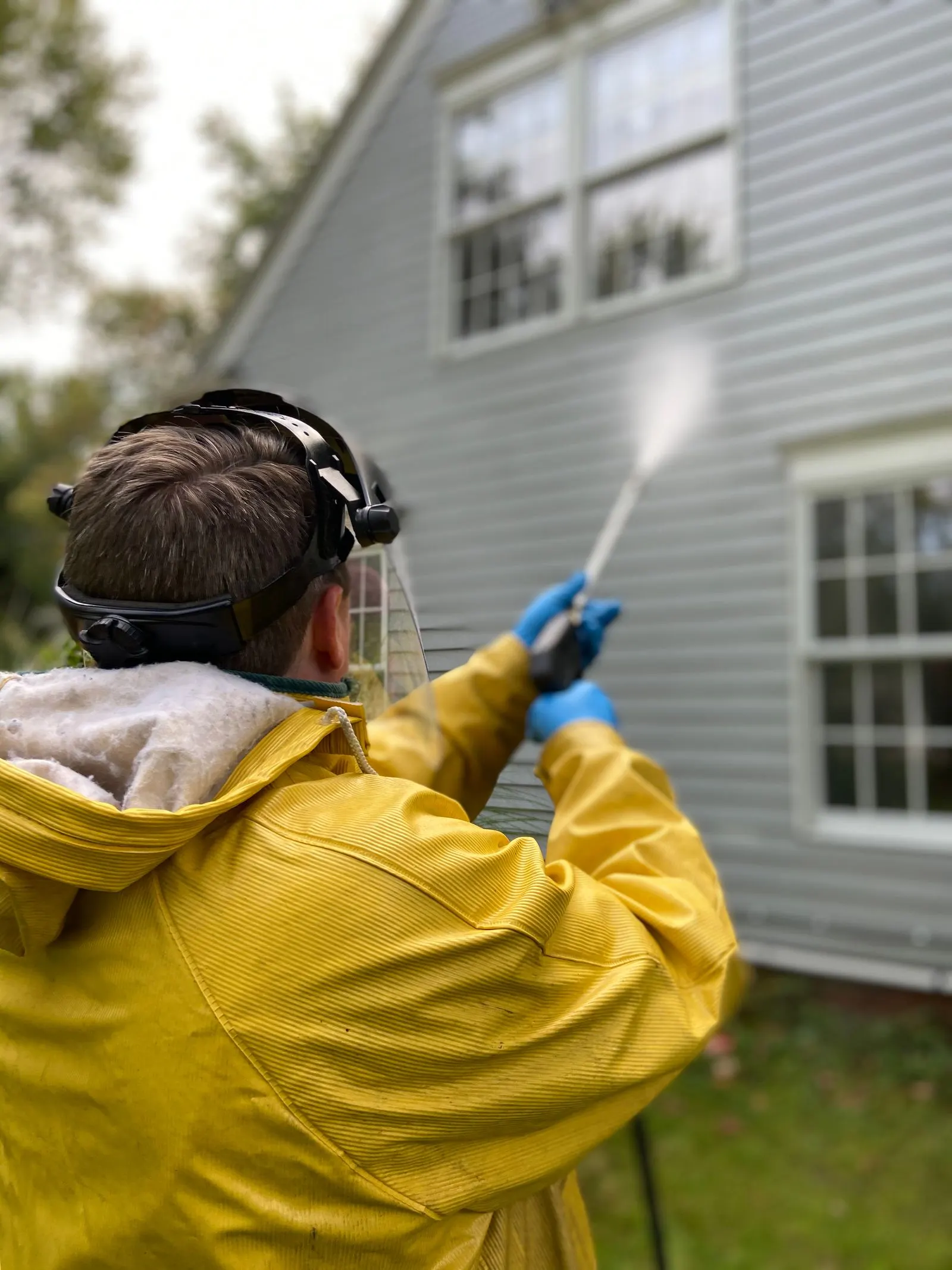 Pressure washing a home's exterior