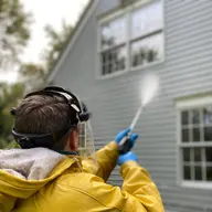 A driveway being pressure washed